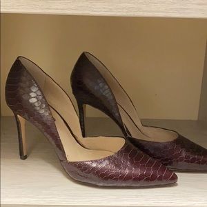 Maroon snakeskin pumps